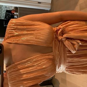 Sabina Musáyev shiny orange shirt
